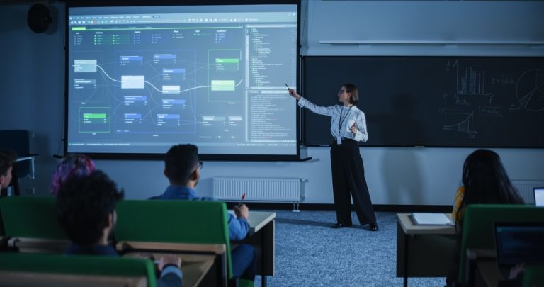 Young,Female,Teacher,Giving,A,Data,Science,Lecture,To,Diverse
